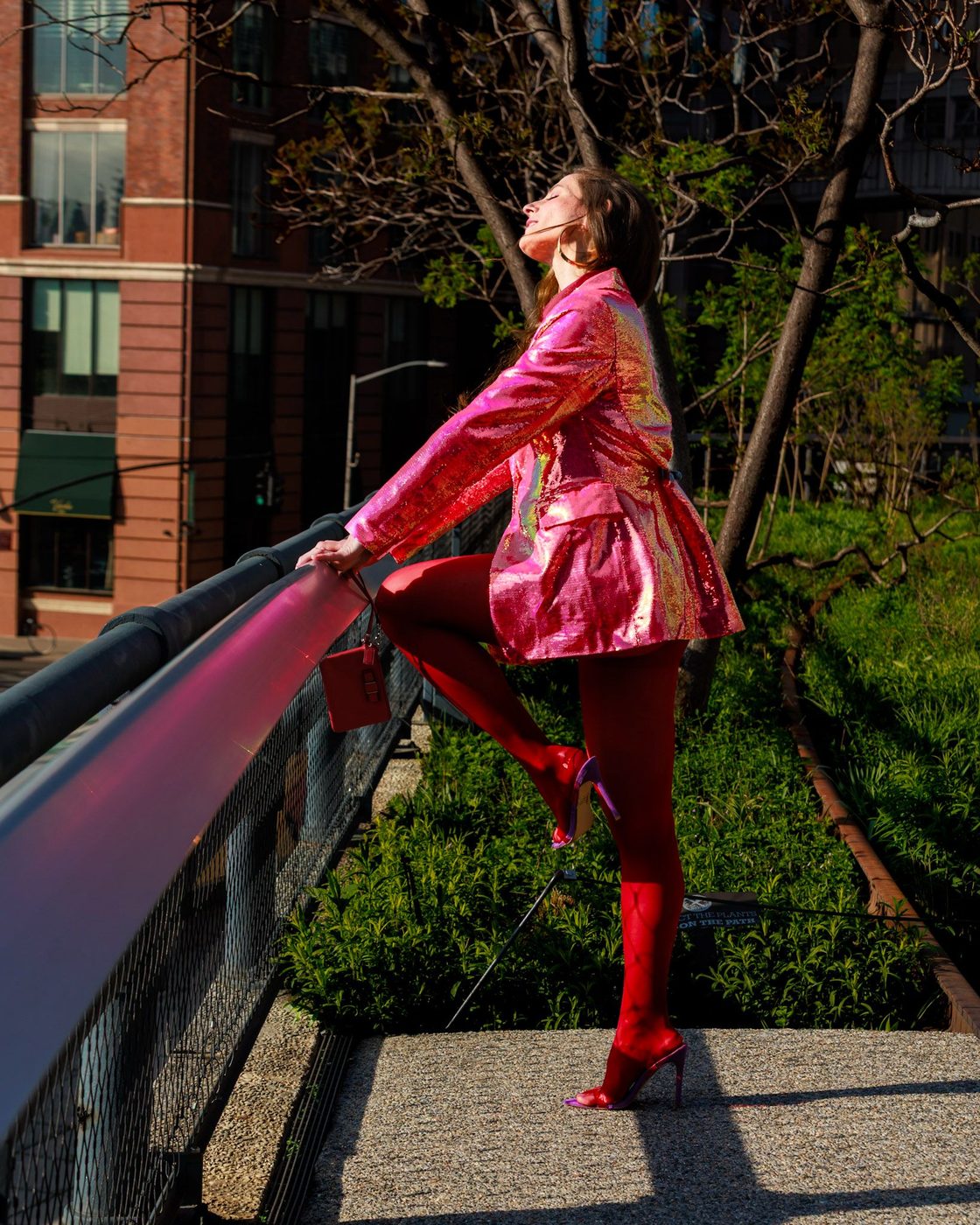 Dynamic high-fashion pose in pink and scarlet on the High Line