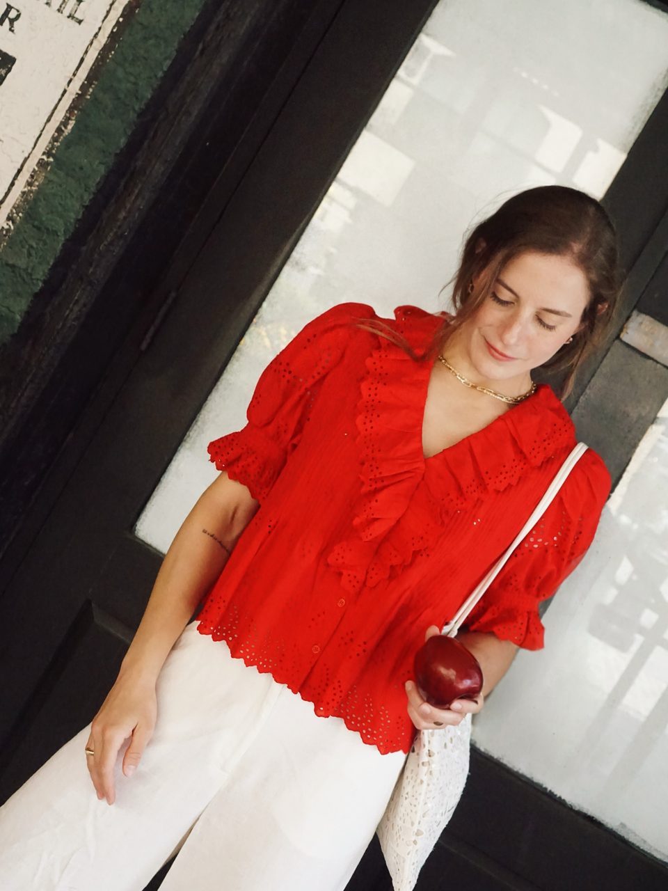 Ultra Pink red blouse, looking down.